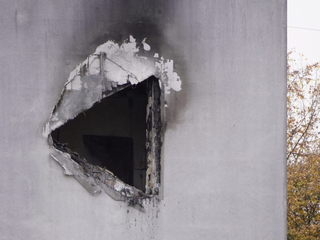 Fire damage restoration services are needed after fire rips through concrete outside a Kansas City, Missouri building.
